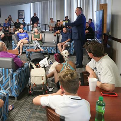 todd gottula talking in front of people on campus